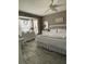 Bright bedroom featuring a white bed set, white dresser, and charming decorations at 18607 Bent Pine Dr, Hudson, FL 34667
