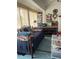 Sunroom/bedroom featuring a daybed, unique decor, and multiple storage options at 18607 Bent Pine Dr, Hudson, FL 34667