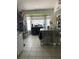 Functional kitchen space showcasing ample counter space, neutral cabinets, and a view of the breakfast nook at 18607 Bent Pine Dr, Hudson, FL 34667