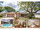 Charming single-story home featuring a two-car garage, a well-manicured lawn, and mature trees offering plenty of shade at 1874 Cameo Way, Clearwater, FL 33756