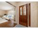 Welcoming foyer featuring a decorative front door and hardwood flooring at 1874 Cameo Way, Clearwater, FL 33756