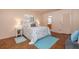 Comfortable main bedroom featuring hardwood flooring, natural light, and a calming color palette at 1874 Cameo Way, Clearwater, FL 33756