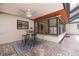 Covered patio with a ceiling fan, perfect for outdoor dining and entertaining with a nice patterned rug at 1874 Cameo Way, Clearwater, FL 33756