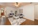 Cozy sitting room featuring hardwood floors, neutral decor, and comfortable seating arrangements at 1874 Cameo Way, Clearwater, FL 33756