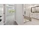 En Suite bathroom features a glass shower, white vanity, and tile floors at 2121 1St N Ave, St Petersburg, FL 33713