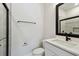 Modern bathroom featuring a glass shower, black fixtures, and a sleek quartz countertop at 2121 1St N Ave, St Petersburg, FL 33713