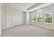 Large bright bedroom with neutral walls, plush carpet, and large windows at 2121 1St N Ave, St Petersburg, FL 33713