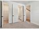 Bedroom features doors to the bathroom, closet, and stairway at 2121 1St N Ave, St Petersburg, FL 33713