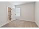 Bright bedroom features large windows, neutral carpet, and an adjacent bathroom at 2121 1St N Ave, St Petersburg, FL 33713