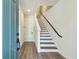 Bright and airy foyer featuring modern staircase, sleek flooring, and a welcoming ambiance at 2121 1St N Ave, St Petersburg, FL 33713