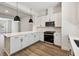 Well-appointed kitchen features an island, modern appliances, white cabinetry, and ample counter space at 2121 1St N Ave, St Petersburg, FL 33713