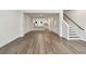 Bright living room open to kitchen with wood floors and staircase to upper level at 2121 1St N Ave, St Petersburg, FL 33713