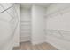 Walk-in closet with carpeted floors, ample shelving and hanging space for storage at 2121 1St N Ave, St Petersburg, FL 33713
