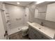 Updated bathroom featuring a walk-in shower, modern vanity, and sleek fixtures at 2306 Hammock Pine Blvd # 2306, Clearwater, FL 33761