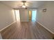 Spacious bedroom features neutral walls, modern floors and ceiling fan at 2306 Hammock Pine Blvd # 2306, Clearwater, FL 33761