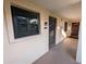 A welcoming entrance featuring a stylish black front door and a window with blinds at 2306 Hammock Pine Blvd # 2306, Clearwater, FL 33761