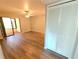 Bright living space features a closet, ceiling fan, and sliding glass door to a screened-in patio at 2306 Hammock Pine Blvd # 2306, Clearwater, FL 33761