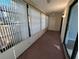 Enclosed patio/sunroom with carpet flooring and multiple windows at 2306 Hammock Pine Blvd # 2306, Clearwater, FL 33761