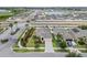Stunning aerial view of a beautiful single-Gathering home in a well-planned community, featuring a lake at 2404 Dovesong Trace Dr, Ruskin, FL 33570
