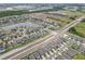 Expansive aerial view of a residential community featuring a mix of homes, green spaces, and interconnected roadways at 2404 Dovesong Trace Dr, Ruskin, FL 33570