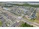 Extensive aerial shot showcasing a well-planned community with numerous homes and scenic lakes at 2404 Dovesong Trace Dr, Ruskin, FL 33570