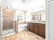 Spacious bathroom with double vanity, soaking tub, and separate shower at 2404 Dovesong Trace Dr, Ruskin, FL 33570