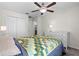 Cozy bedroom featuring a ceiling fan, closet doors, and ample natural light, creating a comfortable retreat at 2404 Dovesong Trace Dr, Ruskin, FL 33570