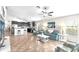 Bright living area flows seamlessly into the kitchen and features neutral paint, tile flooring, and a casual dining space at 2404 Dovesong Trace Dr, Ruskin, FL 33570