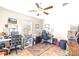 Well-lit office space with dual workstations, ceiling fan, and ample storage at 2404 Dovesong Trace Dr, Ruskin, FL 33570