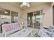 Relaxing screened-in patio with comfortable seating and views of the backyard at 2404 Dovesong Trace Dr, Ruskin, FL 33570