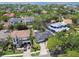 Beautiful aerial view of a residential neighborhood with mature trees and well-maintained homes near a body of water at 2607 S Bryant Cir, Tampa, FL 33629