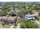 Aerial view of a single-Gathering home outlined in red, nestled among lush trees in a residential neighborhood at 2607 S Bryant Cir, Tampa, FL 33629