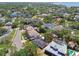 An aerial view highlights a property's boundaries in red within a leafy residential neighborhood near the water at 2607 S Bryant Cir, Tampa, FL 33629