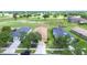 This is an aerial view of a single Gathering home that backs onto a green and beautifully maintained golf course at 2816 Graphite Ct, Valrico, FL 33594
