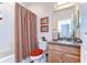 Bathroom featuring a vanity with granite countertop, and a shower-tub combo with a curtain at 2816 Graphite Ct, Valrico, FL 33594