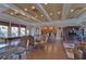 Spacious recreation room with billiards table, comfortable seating, and convenient access to the community kitchen at 2816 Graphite Ct, Valrico, FL 33594