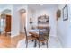 Eat-in dining space featuring tile floors and seamless transition to the hardwood-floored living room at 2816 Graphite Ct, Valrico, FL 33594