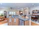 Bright kitchen with bar seating area, stainless steel dishwasher, and views to the living room at 2816 Graphite Ct, Valrico, FL 33594