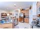 Spacious kitchen featuring stainless steel appliances, tiled floors and bar seating area at 2816 Graphite Ct, Valrico, FL 33594