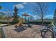 Community playground with play structure, mulch ground cover, and park bench seating at 2816 Graphite Ct, Valrico, FL 33594