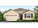 Charming one-story home featuring a beige facade, well-maintained landscaping, and an attached two-car garage at 2967 Gardiner Ln, Zephyrhills, FL 33541