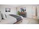 Comfortable main bedroom with a modern bed, neutral walls, and an ensuite bathroom at 32706 Osprey Peak Way, San Antonio, FL 33576