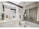 Well-lit bathroom with a shower/tub combo, single vanity, and decorative accents at 3360 Masters Dr, Clearwater, FL 33761