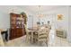 Elegant dining room with a chandelier, tile floors, and ample natural light at 3360 Masters Dr, Clearwater, FL 33761