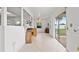 Open concept Florida Room with tile floor, bright light, and sliding glass door to the backyard at 3360 Masters Dr, Clearwater, FL 33761