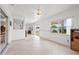 Open Florida room bathed in natural light with tile floors and access to the backyard at 3360 Masters Dr, Clearwater, FL 33761