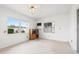 Bright Florida room with tile flooring, windows overlooking the backyard, and neutral wall color at 3360 Masters Dr, Clearwater, FL 33761