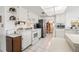 Updated kitchen featuring white cabinets, tile flooring, and stainless steel appliances at 3360 Masters Dr, Clearwater, FL 33761