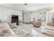 Cozy living room with a fireplace, tile flooring, and comfortable seating at 3360 Masters Dr, Clearwater, FL 33761