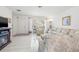 Comfortable living room showcasing tile floors, a fireplace, and a large window at 3360 Masters Dr, Clearwater, FL 33761